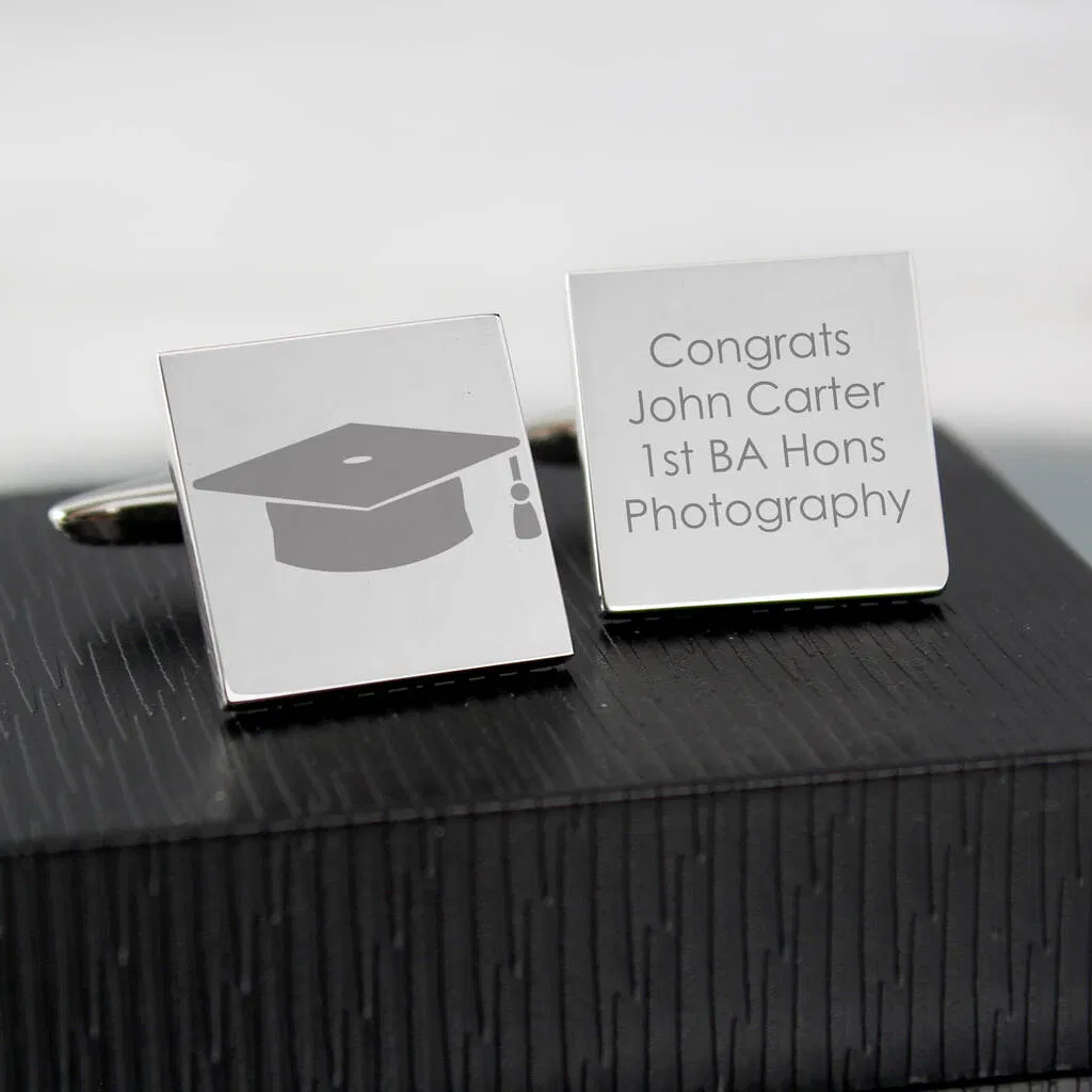 Personalised Square Graduation Cufflinks engraved with a graduation cap symbol on one cufflink and the text "Congrats John Carter 1st BA Hons Photography" on the other. Ideal university graduation gift.