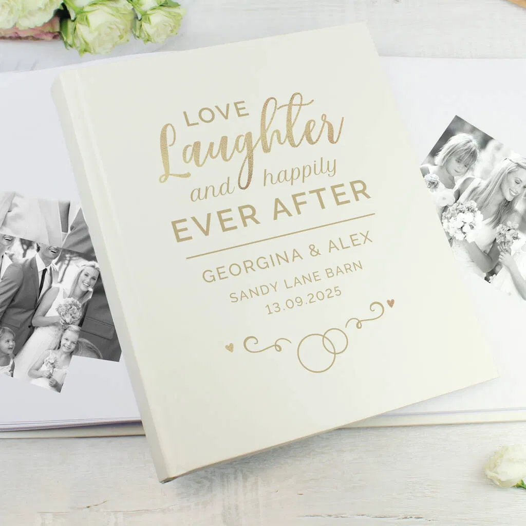 Personalised 'Happily Ever After' photo album in cream and gold with custom names and wedding date, suitable for a wedding gift.