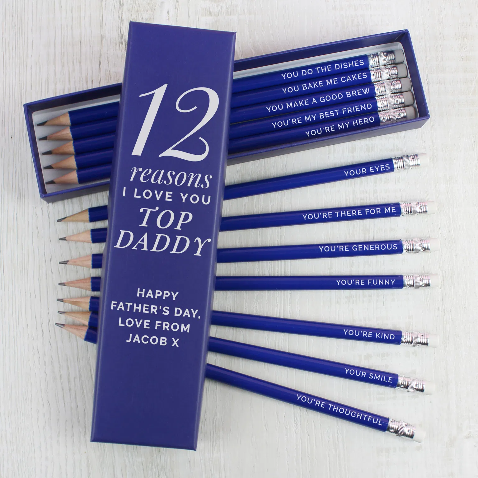 Personalised 12 Reasons Box: A wooden keepsake box with "12 Reasons I Love You" engraved on the lid. Surrounding the box are 12 pencils, each featuring a different custom-engraved message, showcasing a unique and sentimental gift idea.