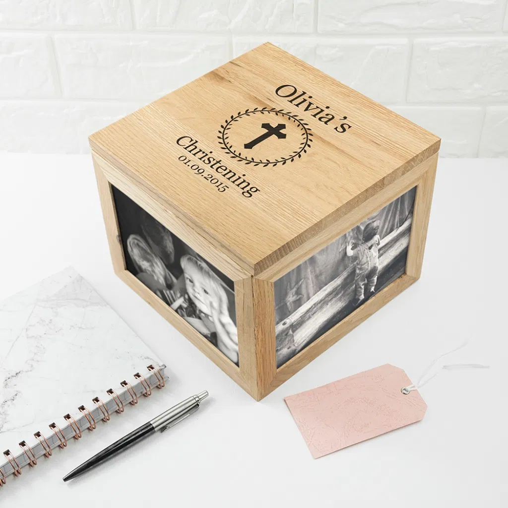 Personalised solid oak Christening photo keepsake box with engraved cross, leaf frame, and space for four large photos.